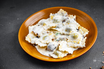 ravioli seafood cream sauce pasta meal food snack on the table copy space food background rustic top view