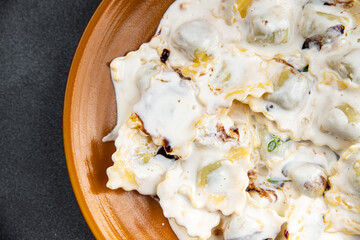 ravioli seafood cream sauce pasta meal food snack on the table copy space food background rustic top view