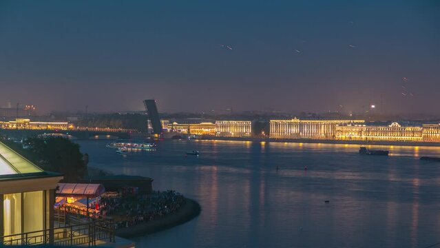 Aerial timelapse of fireworks above St. Petersburg, Russia during the Scarlet Sails festival. Shot from a rooftop, featuring Trinity Bridge and waterfront