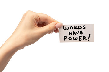 Words have power text on a card in a woman hand isolated.