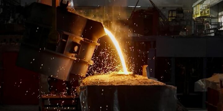 Liquid iron molten metal pouring in container, industrial metallurgical factory, foundry cast, heavy industry