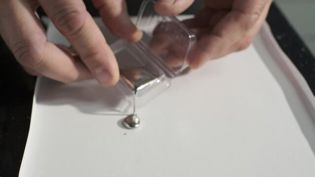 chemical element Mercury hydrargyrum Hg quicksilver heavy liquid metal scientific experience.