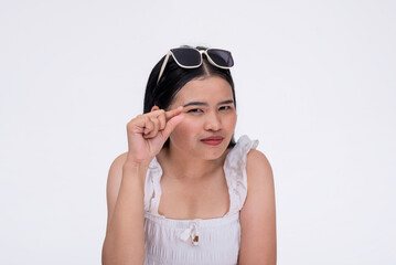 A mean young asian woman belittling the size of your package. Mocking gesture with fingers....