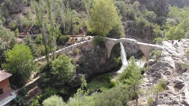 Usak Clandras bridge and waterfall in autumn season in Turkey