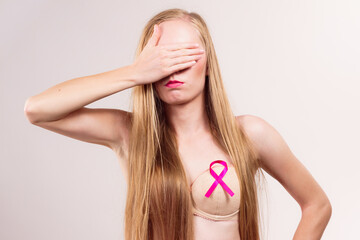 Woman pink cancer ribbon on breast