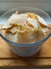 Noodles in the shape of a rectangle in a glass bowl