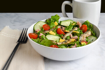 salad top with  sardines and tuna