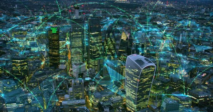 Aerial view of London with Connections at Night. Smart City View. Concepts: Augmented Reality, Internet of Things, 5G, Modern Wifi. Shot from Helicopter in 8K.