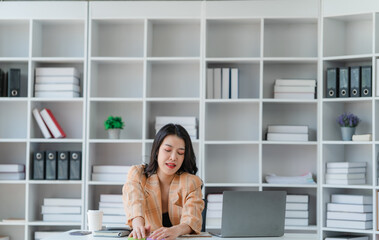 Portrait of happy young business asian woman celebrating success with arms up. positive expression, sucess in business concept