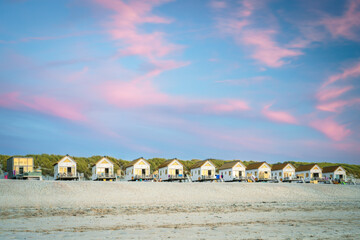 Row of rentable tiny homes along the dutch sea coast - obrazy, fototapety, plakaty