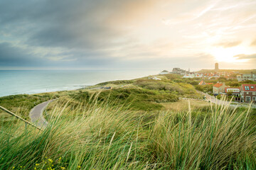 Coastline with a view over the dunes and the seaside resort of Domburg at sunset