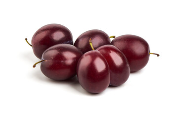 Isolated plums. One and a half of blue plum fruit with leaves isolated on white background.