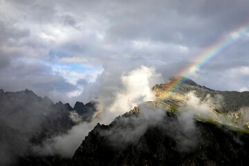 rainbow above mountain peak