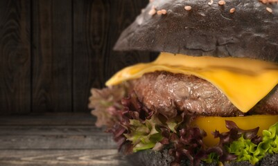Tasty fresh hamburger on wooden desk