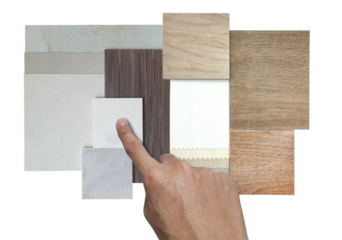 interior architect chooses material samples including blackout drapery fabric catalog, wooden ceramic tiles, walnut veneer, concrete laminates, stone tiles isolated on background with clipping path. 