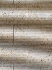 texture of a tiled beige stone wall with a horizontal joint pattern as background, natural stone...
