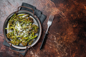 Roast Broccolini cabbage with crispy parmesan cheese. White background. Top view. Copy space