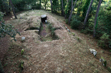 Carnac, France. Kerlescan North passage grave allee couverte burial mound from east shows entrance, capstone and peristalith
