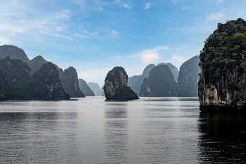 Panoramic view over water of Halong Bay, Vietnam with characteristic monolithic limestone karsts...