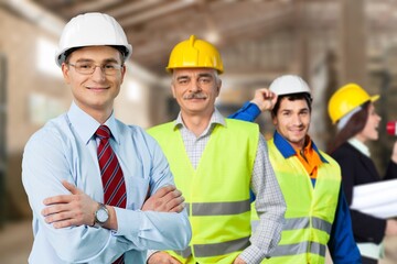 Group of factory workers together at work in industry factory,