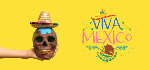 Greeting card for Independence day of Mexico with painted skull and sombrero hat