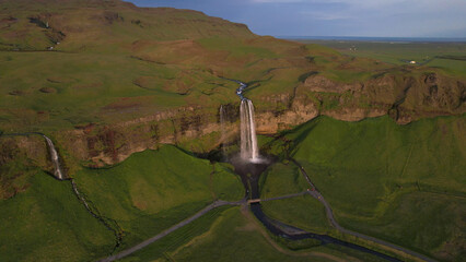 The Seljalandsfoss waterfall on the south coast of Iceland bathed in the otherworldly light of the...