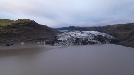 Aerial view of the Solheimajokull is an outlet glacier of the mighty icecap of Myrdalsjokull on the South Coast of Iceland. It is the fourth-largest ice cap in Iceland.