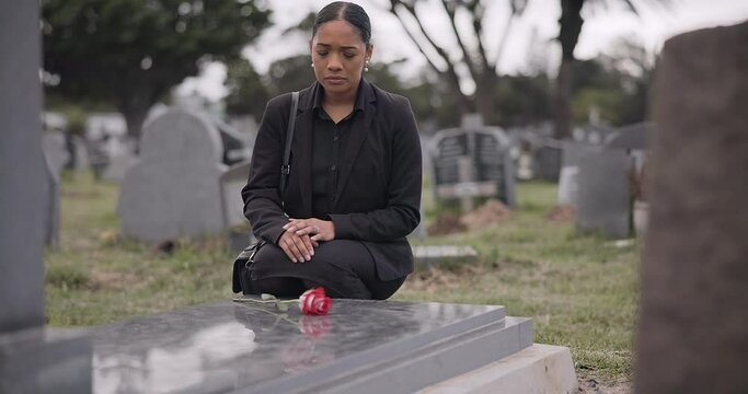 Sad woman, graveyard and rose on tombstone in mourning, loss or grief at funeral or cemetery. Female person with flower in depression, death or goodbye at memorial or burial service for loved one