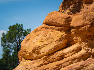 Abstract Rustrel canyon ocher cliffs landscape. Provencal Colorado near Roussillon, Southern France.