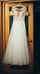 Fototapeta na wymiar Warm sun rays highlight the exquisite A-line silhouette of the bridal gown in a serene setting.