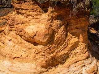 Abstract Rustrel canyon ocher cliffs landscape. Provencal Colorado near Roussillon, Southern France.