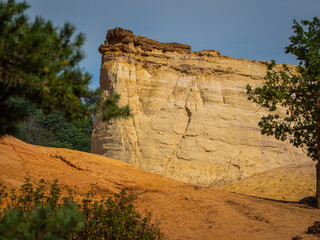 Abstract Rustrel canyon ocher cliffs landscape. Provencal Colorado near Roussillon, Southern France.