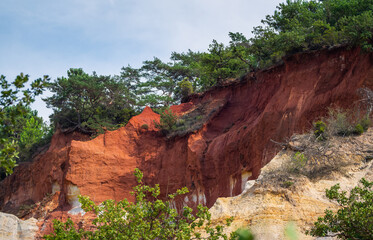 Abstract Rustrel canyon ocher cliffs landscape. Provencal Colorado near Roussillon, Southern France.