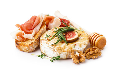 Tasty baked Camembert cheese and sandwiches with jamon on white background