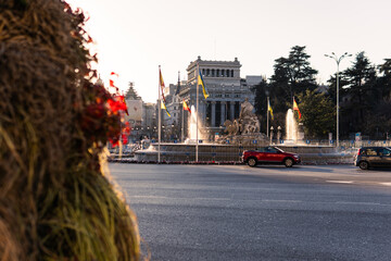 Puerta de Alcalá, traffic circle in the center of Madrid on sunset, Spain