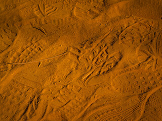 Fototapeta premium Footprints left on the red sand. Abstract Rustler canyon moher cliffs landscape. Provencal Colorado near Roussillon, Southern France.