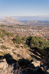 View of the town of Bustarviejo from the mountain canyons
