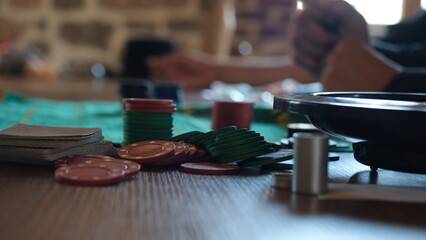 man playing roulette wheel in casino