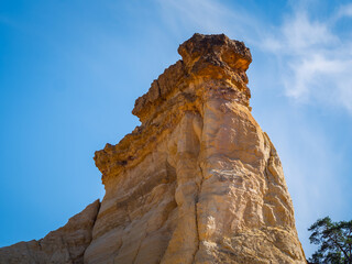 Abstract Rustrel canyon ocher cliffs landscape. Provencal Colorado near Roussillon, Southern France.