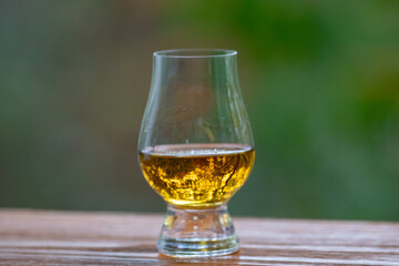 Single malt scotch whisky in selective focus and minimalistic photo. Space for text