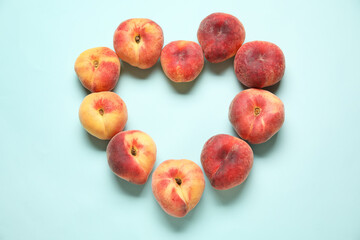 Frame made of sweet fig peaches on blue background