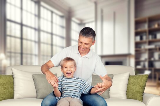 Happy young father and child at home together, AI generated image