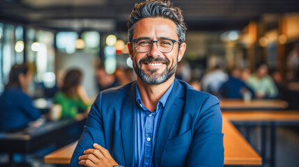 Obraz premium portrait of a smiling businessman with graying hair and beard wearing glasses 