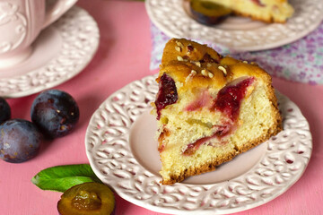 Sweet fluffy cake with fresh plums and hazelnuts - 640386081