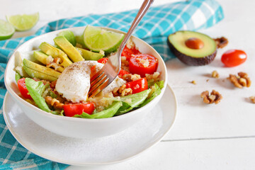 Avocado and poached egg quinoa bowl 

