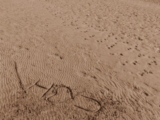 Fototapeta na wymiar Beach. Love. i Love You. Sand.