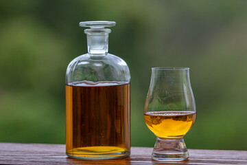 Single malt scotch whisky in selective focus and minimalistic photo. Space for text