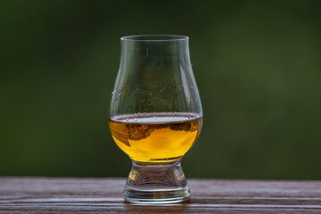 Single malt scotch whisky in selective focus and minimalistic photo. Space for text
