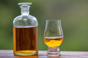 Single malt scotch whisky in selective focus and minimalistic photo. Space for text