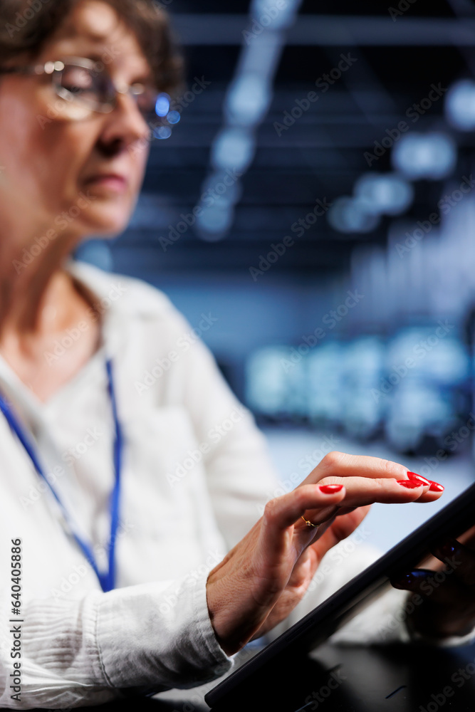 Poster licensed computer operator using tablet to assess server security vulnerabilities arising due to uns